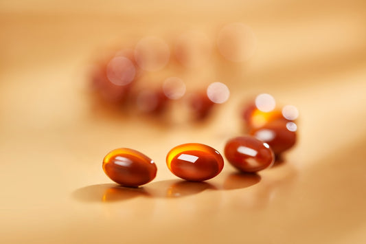 Blood sugar supplement bottle with healthy fruits and leaves.