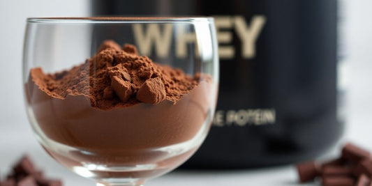 Chocolate whey protein powder scoop with powder.