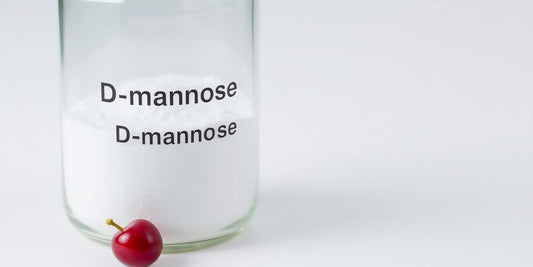 Woman holding a bottle of D-mannose supplement.