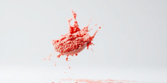 BCAA fruit punch powder scoop with splash.